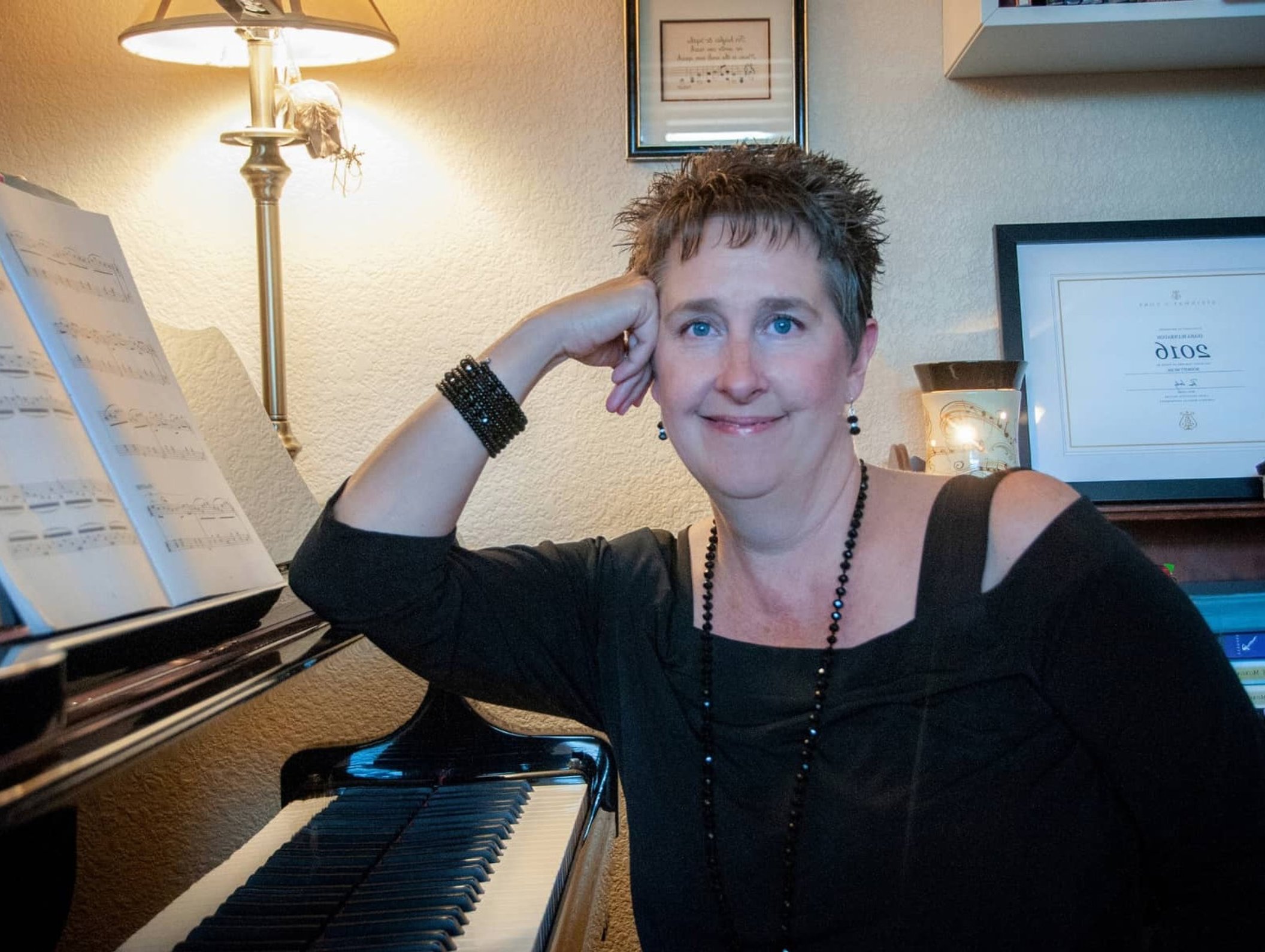 Diana Bluebaugh teaching an online piano lesson from her Monument, CO studio